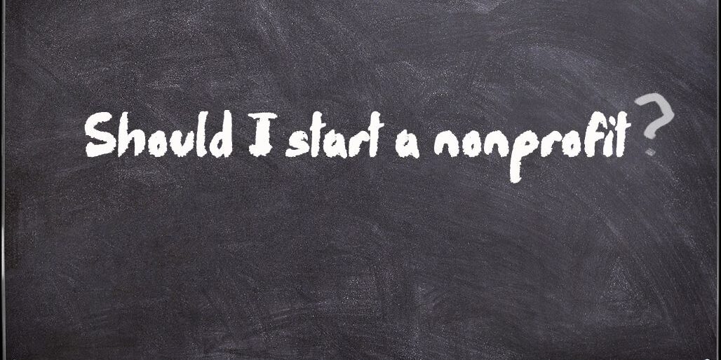 Should I start a nonprofit? virtual chalkboard image with white text written in chalk that reads "Should I start a nonprofit?"